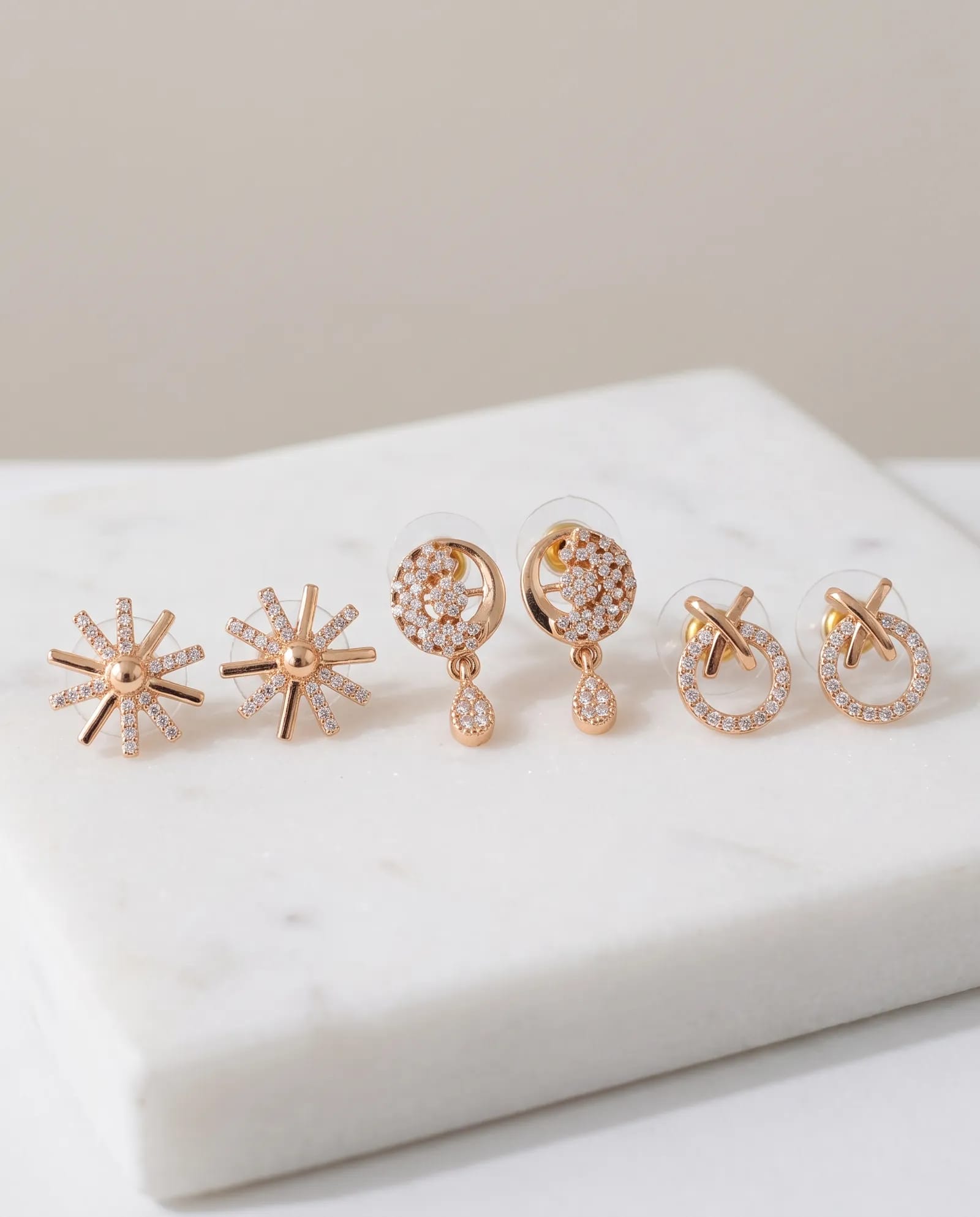 3 pieces Daily Wear Earrings Combo laid on white marble