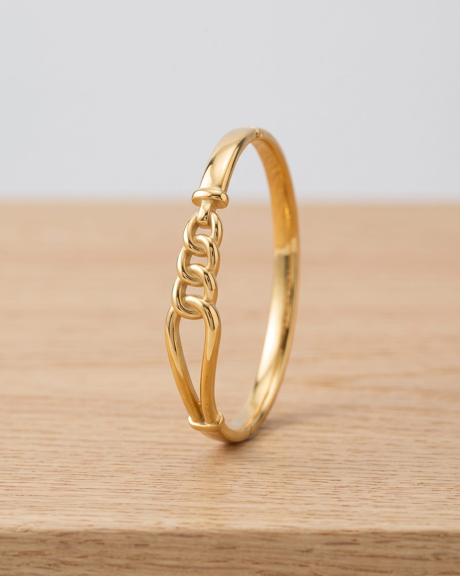 Anti Tarnish Loop Bangle laid on white marble
