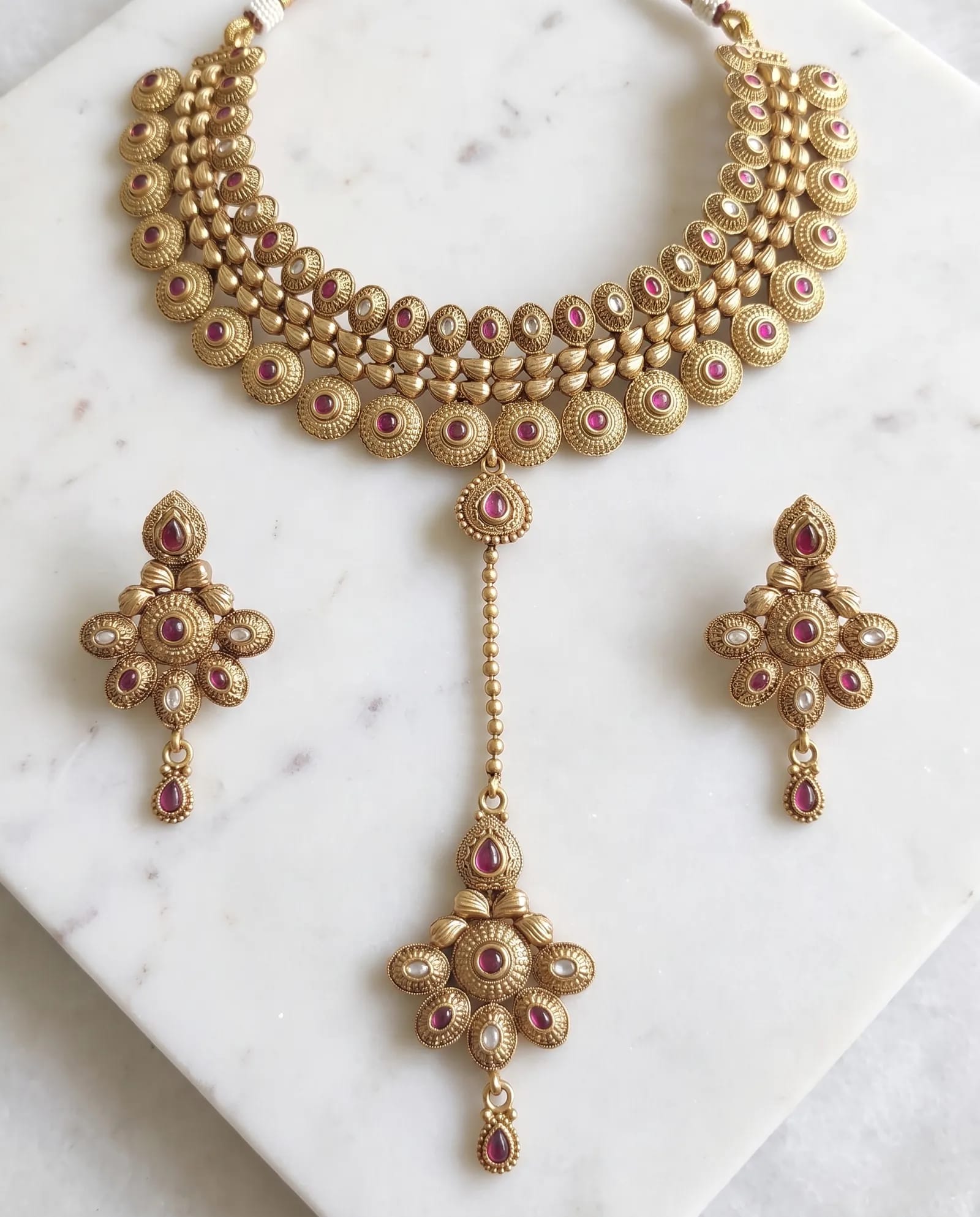 Antique Choker set laid on white marble