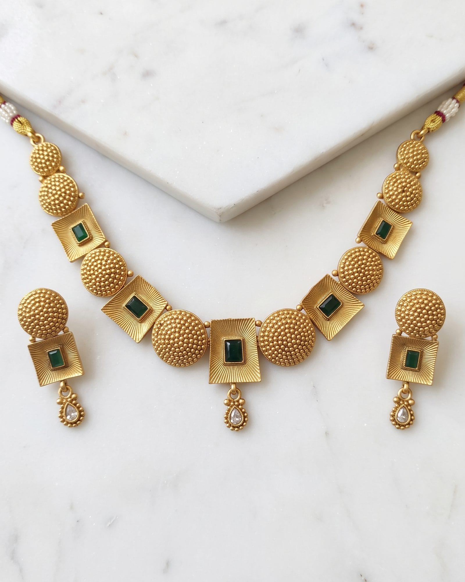 Geometric Green Stone Antique Choker Set laid on white marble