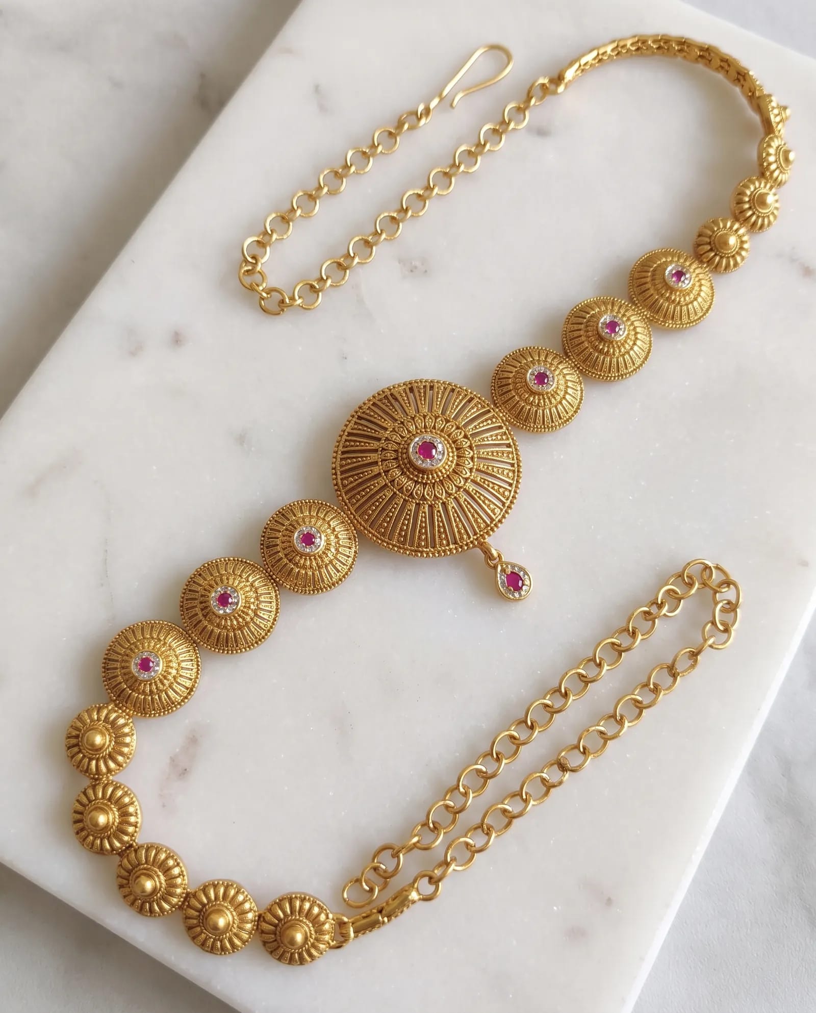 Antique Waist Chain laid on white marble