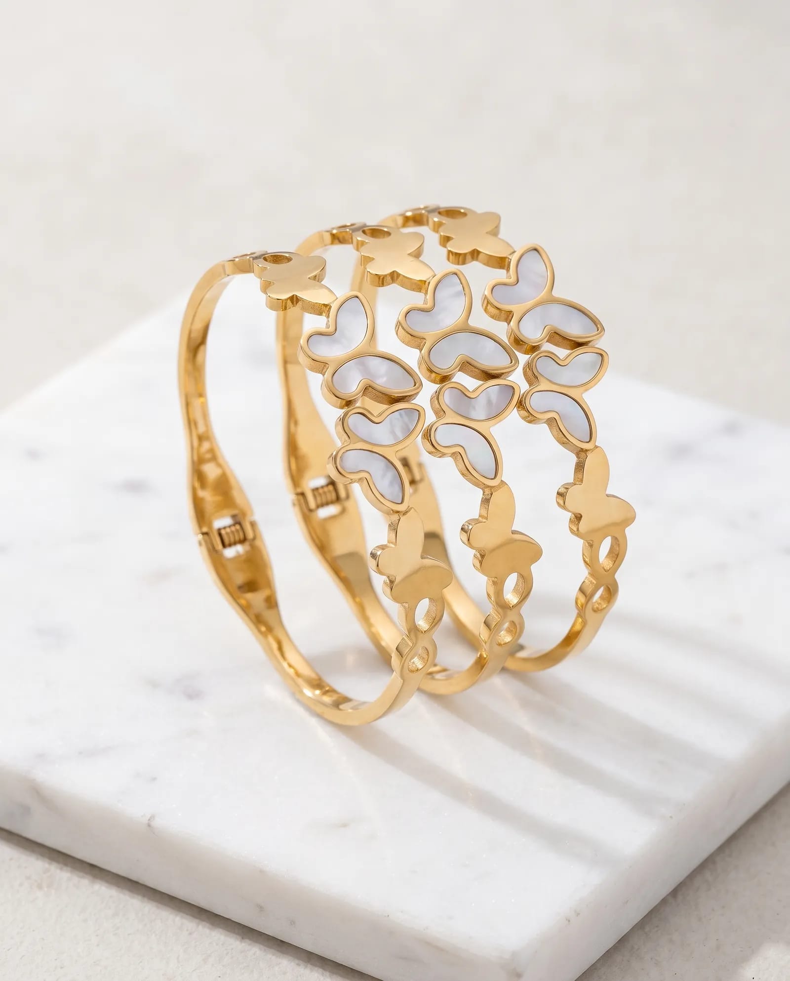 Butterfly Bangle Anti Tarnish laid on white marble