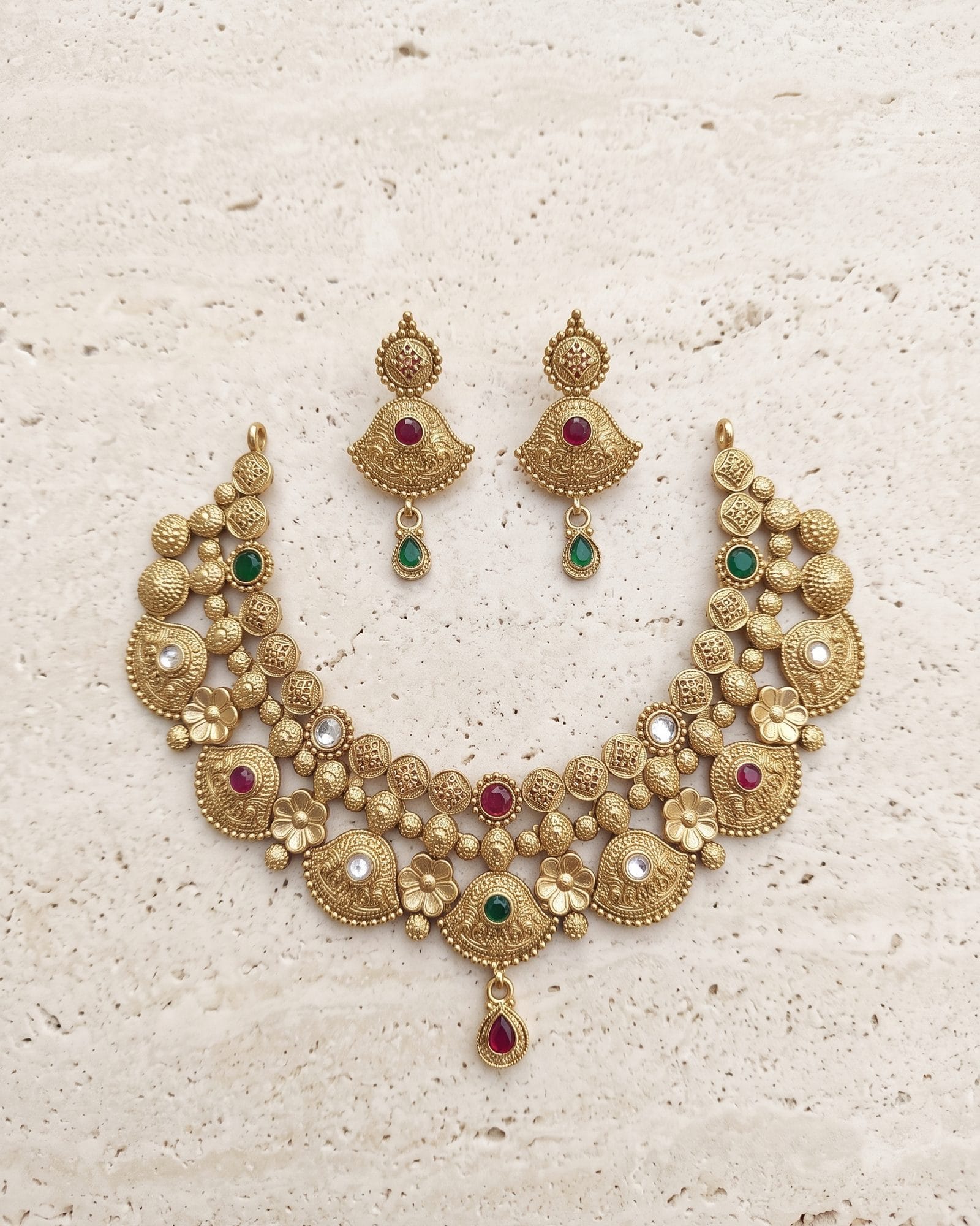 Antique Floral Multicolour Stone Choker Set laid on white marble