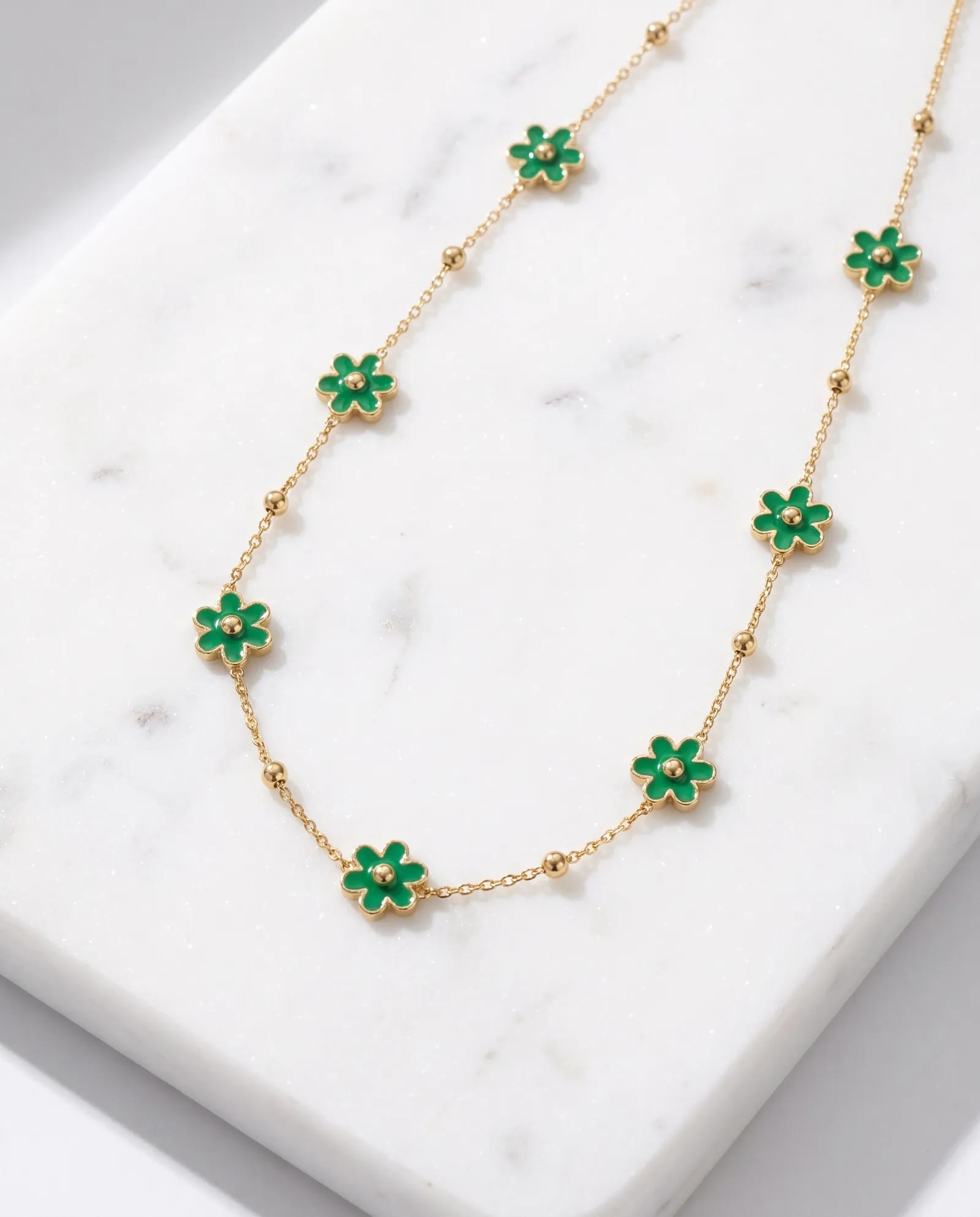Green Charm Chain Anti Tarnish laid on white marble