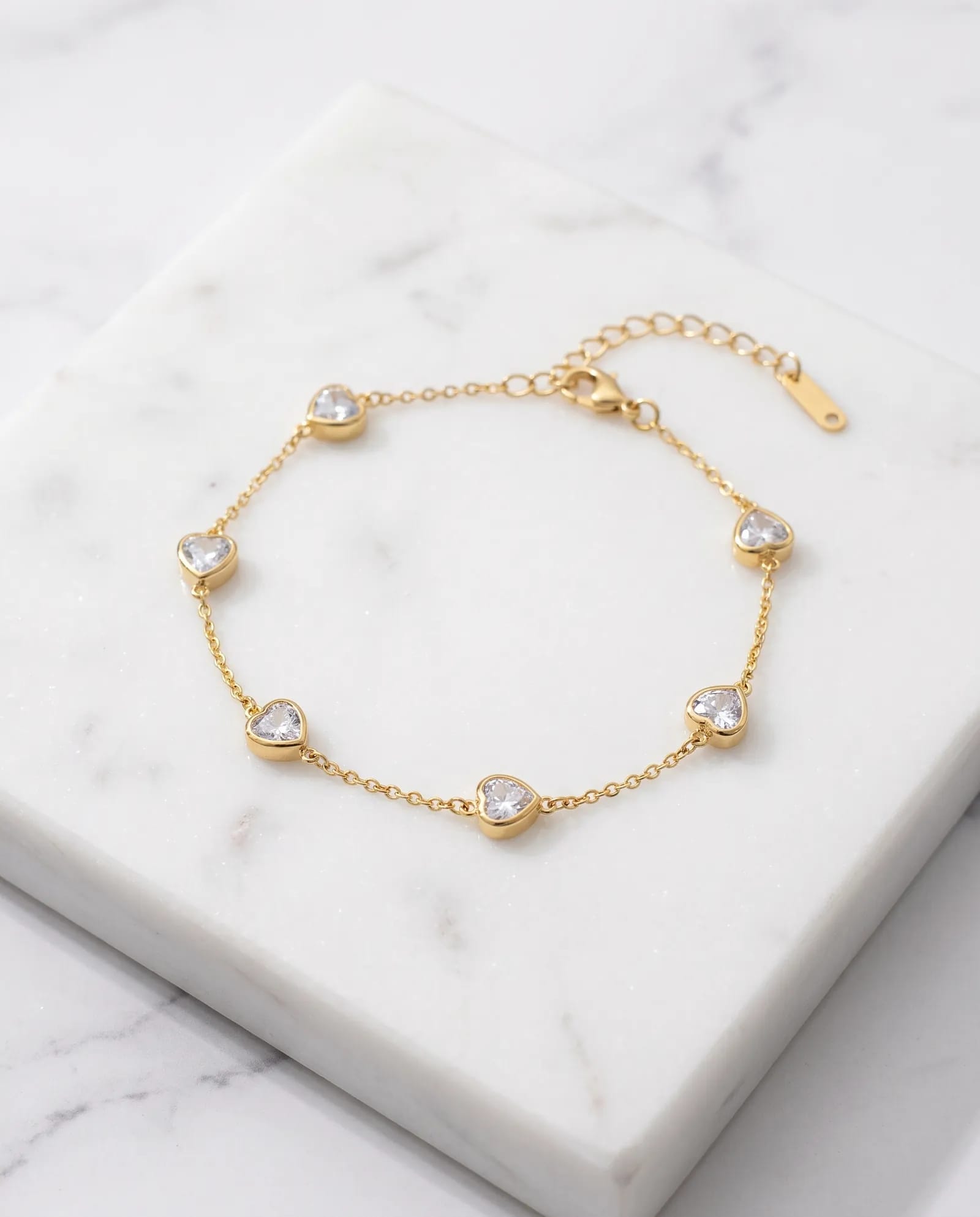 Love Heart Charm Bracelet Anti Tarnish laid on white marble