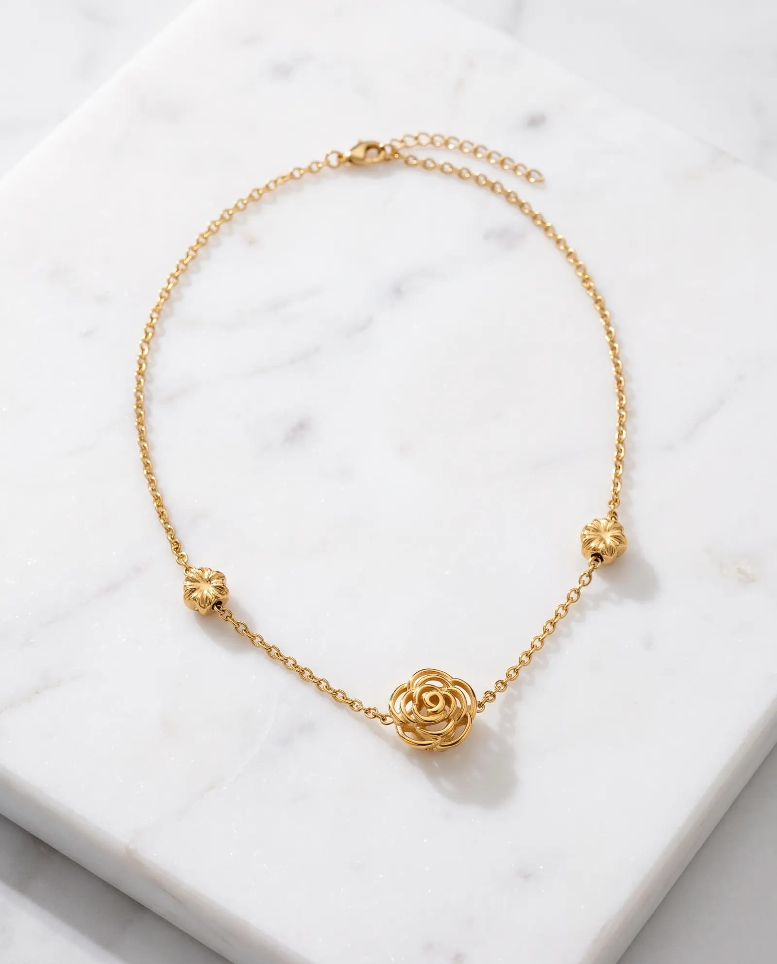 Petite Rose Chain 316L stainless steel laid on white marble