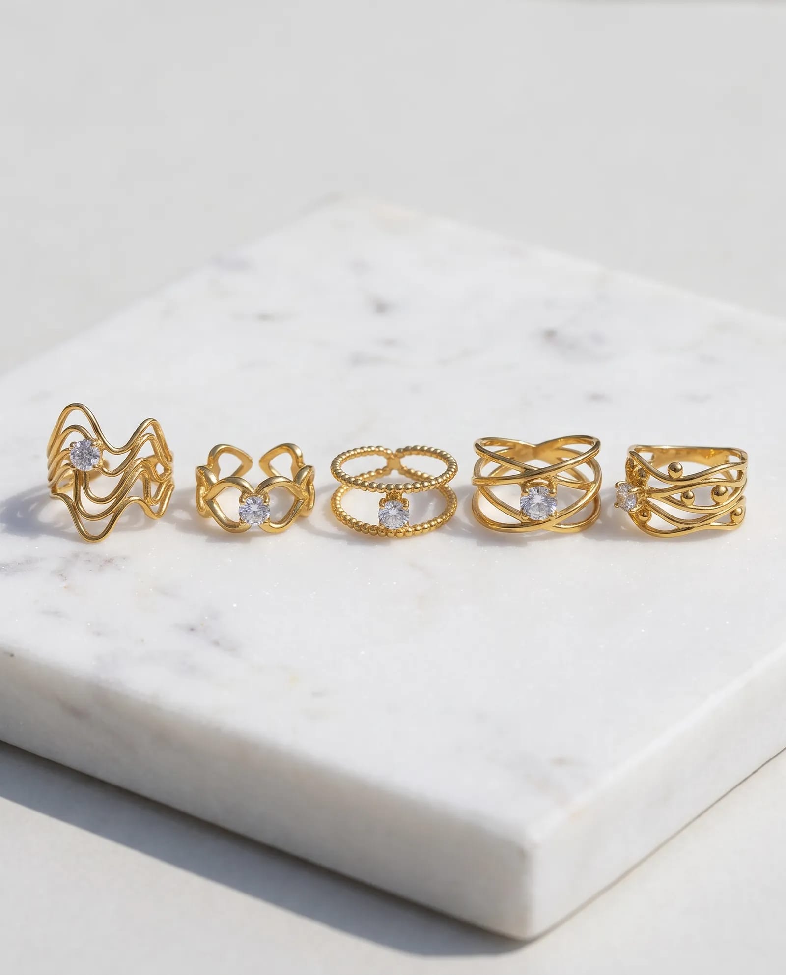 5-Piece Anti-Tarnish Openwork Ring Combo laid on white marble