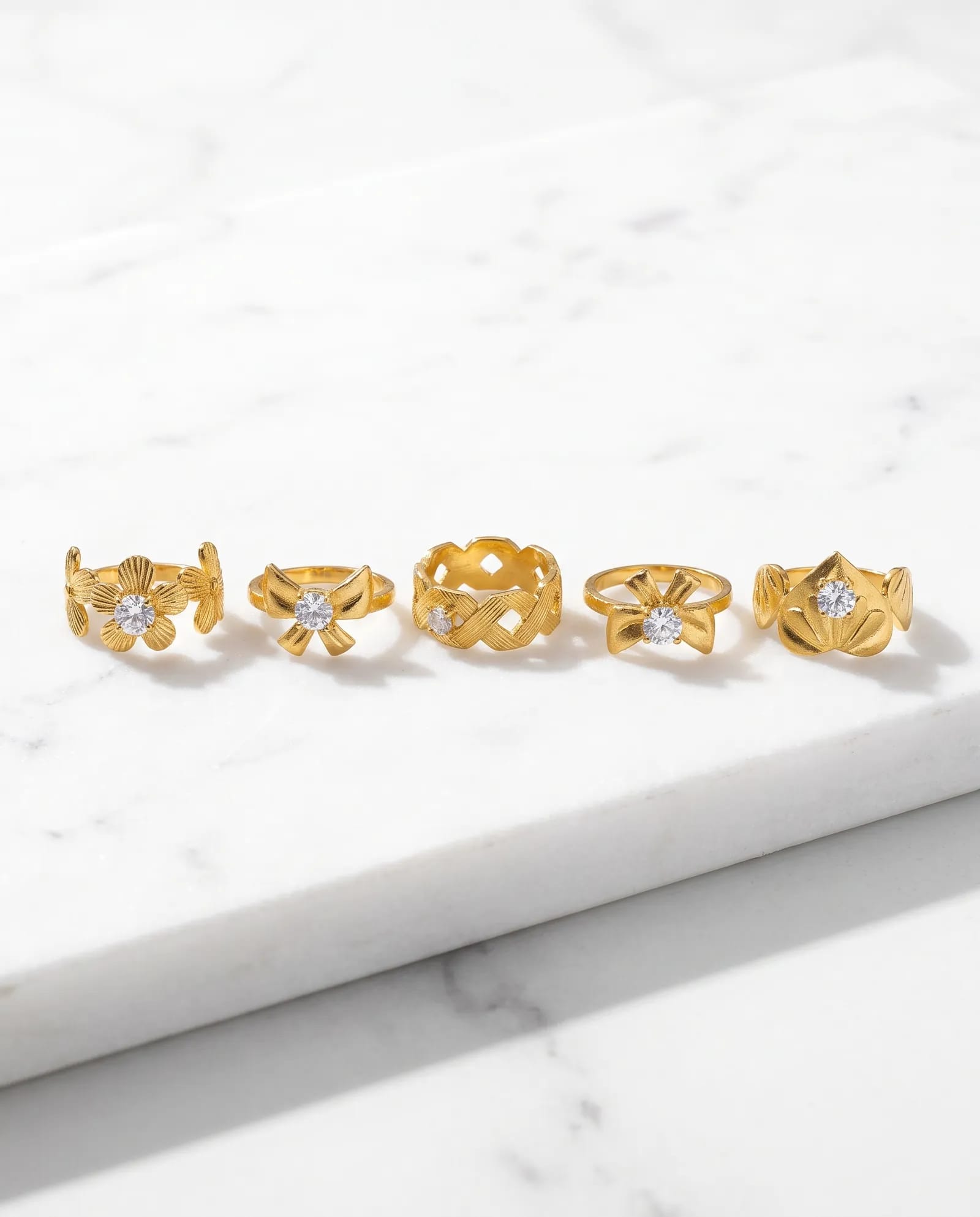 5-Piece Anti-Tarnish Floral Ring Combo laid on white marble