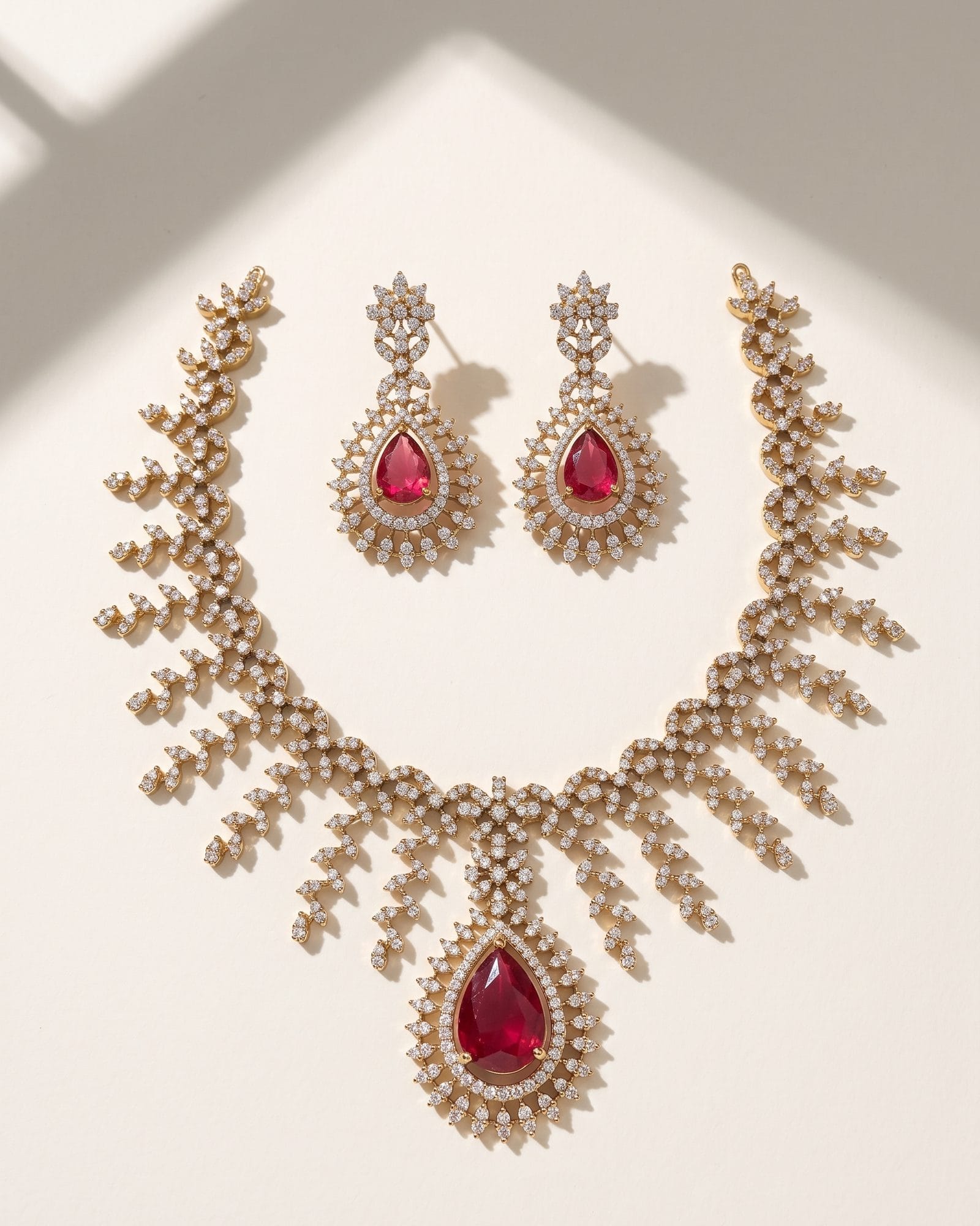 Teardrop Red AD Stone Necklace laid on white marble