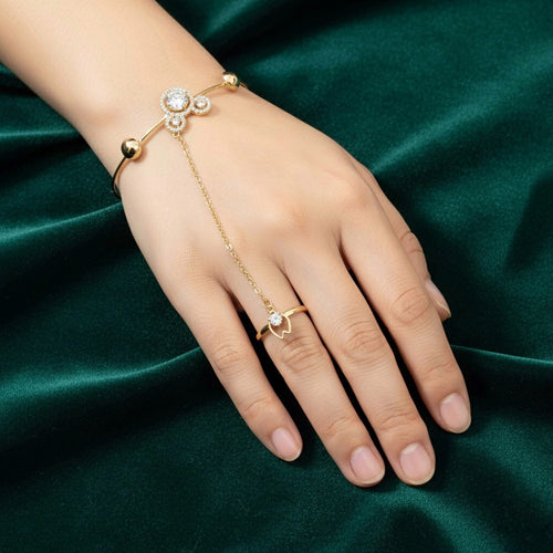Anti-tarnish trefoil hand harness bracelet with clear crystal-style motif worn on hand