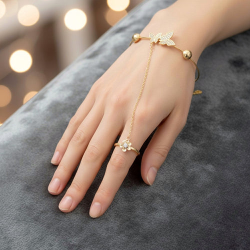 Anti-tarnish crystal motif hand harness bracelet worn with a flower ring